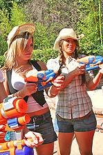 Three chicks with water guns