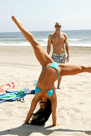 Johnny watches Cherokee do a cartwheel